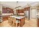 A gourmet kitchen with a center island, stainless steel appliances, and custom cabinetry at 2672 Brickell Square, Atlanta, GA 30341