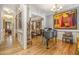 Elegant living area with gleaming hardwood floors, large painting, and decorative moldings at 2672 Brickell Square, Atlanta, GA 30341