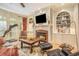 Inviting living room with a fireplace, built-in bookshelves, and comfortable seating at 2672 Brickell Square, Atlanta, GA 30341