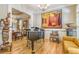 Elegant living room with hardwood floors, a piano, and views into the dining area at 2672 Brickell Square, Atlanta, GA 30341