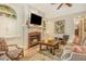 Warm living room with a fireplace, built-in cabinets, and view of the front yard at 2672 Brickell Square, Atlanta, GA 30341