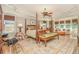 Bright main bedroom suite with four-poster bed, sitting area, large windows, and hardwood floors at 2672 Brickell Square, Atlanta, GA 30341