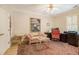 This office has a ceiling fan, a window with plantation shutters, and a small decorative sofa at 2672 Brickell Square, Atlanta, GA 30341