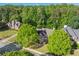 An aerial view of a beautiful home with mature trees at 3220 Goldmist Dr, Buford, GA 30519