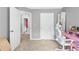 Neutral bedroom offers plenty of space for a desk and bed at 3220 Goldmist Dr, Buford, GA 30519