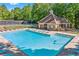 Large, inviting community pool area with lounge chairs and tables, perfect for relaxing and socializing at 3220 Goldmist Dr, Buford, GA 30519