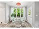 Bright breakfast nook offers a charming space to enjoy meals with great natural lighting at 3220 Goldmist Dr, Buford, GA 30519