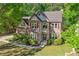 Beautiful two-story home with well-manicured front lawn and landscaping at 3220 Goldmist Dr, Buford, GA 30519