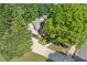 Home's exterior with a large front yard and driveway at 3220 Goldmist Dr, Buford, GA 30519