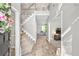 Bright foyer features new flooring, stairs to the second floor, and an open view to other rooms at 3220 Goldmist Dr, Buford, GA 30519