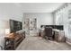 Home office space with gray walls, built in shelving, multiple monitors and comfortable chair at 3220 Goldmist Dr, Buford, GA 30519