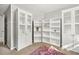 Spacious room with ample storage offered by built-in cabinets and shelving at 3220 Goldmist Dr, Buford, GA 30519