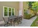 Outdoor patio area ideal for entertaining with shade and lush greenery at 3220 Goldmist Dr, Buford, GA 30519