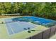 Well-maintained tennis courts with lighting, ideal for daytime or evening matches at 3220 Goldmist Dr, Buford, GA 30519