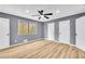 Comfortable bedroom featuring a ceiling fan, window, and closet space at 6684 Heathrow Ln, Stone Mountain, GA 30087