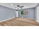 Light-filled bedroom with ceiling fan, closet, and exterior views at 6684 Heathrow Ln, Stone Mountain, GA 30087