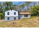 Charming two-story home featuring a blue front door and a well-maintained front yard at 6684 Heathrow Ln, Stone Mountain, GA 30087