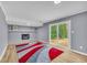 Cozy living room with fireplace and sliding glass doors to backyard at 6684 Heathrow Ln, Stone Mountain, GA 30087