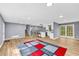 Expansive living area with hardwood floors, open layout, and access to kitchen and backyard at 6684 Heathrow Ln, Stone Mountain, GA 30087