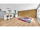 Bright, open-concept living area featuring a modern kitchen and hardwood floors at 6684 Heathrow Ln, Stone Mountain, GA 30087