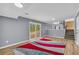 Open living room area with stairs and sliding glass doors leading to outside at 6684 Heathrow Ln, Stone Mountain, GA 30087