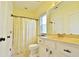 Bathroom with white vanity, marble countertop and shower curtain at 1005 Woodbury Rd, Canton, GA 30114