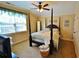 Four-poster bed with green window treatment and carpet flooring at 1005 Woodbury Rd, Canton, GA 30114