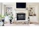 Living room fireplace with stone surround and built in shelves at 1005 Woodbury Rd, Canton, GA 30114