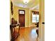 Home foyer featuring a hardwood floor, decorative table and traditional front door at 1005 Woodbury Rd, Canton, GA 30114
