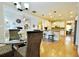 Open kitchen with an island, counter seating, stainless steel appliances, and hardwood floors at 1005 Woodbury Rd, Canton, GA 30114