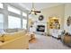 Inviting living room with a fireplace, built-in shelving and many windows at 1005 Woodbury Rd, Canton, GA 30114