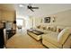 Living room with carpet flooring and a sectional sofa with accent pillows at 1005 Woodbury Rd, Canton, GA 30114