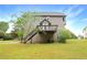 Expansive backyard features well-maintained lawn, and private deck and mature trees at 21 Wisteria Run, Hiram, GA 30141