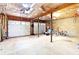 Spacious basement featuring large garage doors, perfect for storage or workshop at 21 Wisteria Run, Hiram, GA 30141