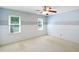 Bedroom features ceiling fan and two windows at 21 Wisteria Run, Hiram, GA 30141