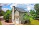 View of home highlighting the well-maintained siding, mature trees, and attached garages at 21 Wisteria Run, Hiram, GA 30141