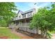 Well-maintained home with a spacious wrap-around porch and mature trees in a serene setting at 21 Wisteria Run, Hiram, GA 30141