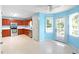 Open kitchen featuring stainless steel appliances, light tile floors, and wood cabinets at 21 Wisteria Run, Hiram, GA 30141