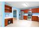 Spacious kitchen with stainless steel appliances, cherry wood cabinets, and ample counter space at 21 Wisteria Run, Hiram, GA 30141