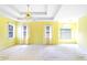 Bright main bedroom featuring tray ceilings and lots of windows for natural light at 21 Wisteria Run, Hiram, GA 30141