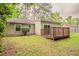 A shady backyard with a wooden deck attached to the home at 2469 Newgate Dr, Decatur, GA 30035