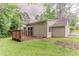 A charming home with a wooden deck in a grassy, shaded backyard at 2469 Newgate Dr, Decatur, GA 30035