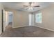 Bedroom featuring a ceiling fan, window, and en suite bathroom access at 2469 Newgate Dr, Decatur, GA 30035