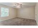 Spacious bedroom features neutral walls, carpet, ceiling fan, and a window for natural light at 2469 Newgate Dr, Decatur, GA 30035