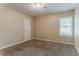 Bedroom featuring carpeted floors, a window with blinds, and neutral walls at 2469 Newgate Dr, Decatur, GA 30035