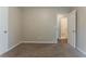 Bedroom with neutral walls, carpet, and doorway leading to the bathroom at 2469 Newgate Dr, Decatur, GA 30035
