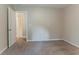 Bedroom showcasing neutral walls, carpeted floors, and a view into the en suite bathroom at 2469 Newgate Dr, Decatur, GA 30035