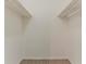 Spacious walk-in closet with shelving and carpeted floor at 2469 Newgate Dr, Decatur, GA 30035