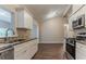 Corner view of kitchen showcasing stainless steel appliances, granite countertops and wood flooring at 2469 Newgate Dr, Decatur, GA 30035