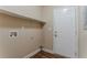 A clean laundry room features a built-in shelf above the washer and dryer hookups at 2469 Newgate Dr, Decatur, GA 30035